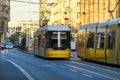 Yellow tram drives along a street. The Berlin tramway German: StraÃÅ¸enbahn Berlin is the main